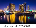 Marina and buildings reflecting at the Embarcadero at night in San Diego, California.