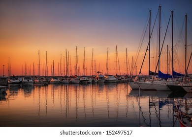 Marina with docked yachts at sunset in Giulianova, Italy - Powered by Shutterstock