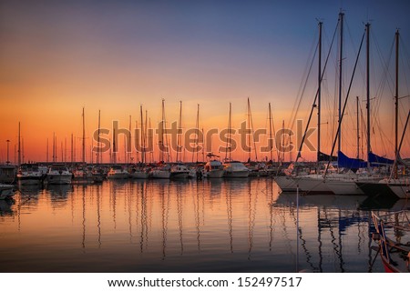 Marina with docked yachts at sunset in Giulianova, Italy