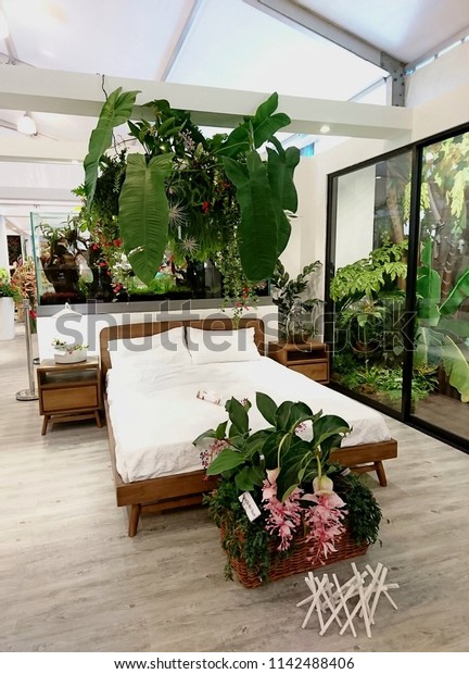 Marina Gardens Drive, Singapore - July 24, 2018: In\
Gardens Festival, the Gardening Society showcases indoor design\
concept using plants as divider, aquaponics, terrarium and balcony\
decoration. 