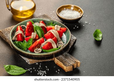 marinated anchovies, fresh tomato, olive oil. Delicious spanish tapas, place for text, top view, - Powered by Shutterstock