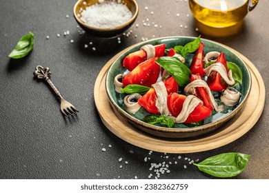 marinated anchovies, fresh tomato, olive oil. Delicious spanish tapas, place for text, top view, - Powered by Shutterstock