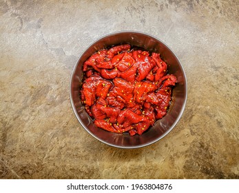 Marinated Beef Strips In A Metal Container Prepared For Drying And Making A Beef Jerky