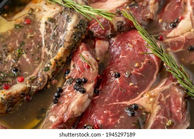 Marinated beef t-bone steak on white wood background. Meat background. Meat close-up - Powered by Shutterstock