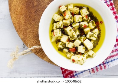 Marinated feta in olive oil, with garlic, chilli and peppercorn.