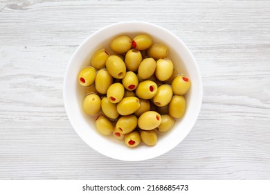 Marinated Green Olives With Pimento Peppers In A Bowl, Top View. Flat Lay, Overhead, From Above.