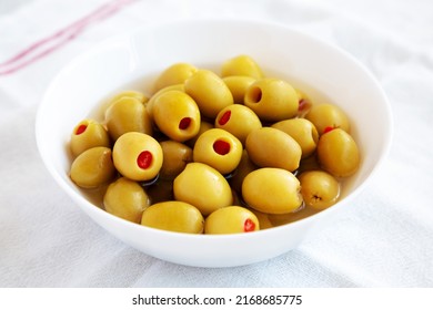 Marinated Green Olives With Pimento Peppers In A Bowl, Side View. 