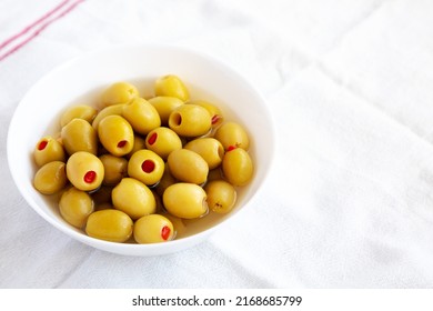 Marinated Green Olives With Pimento Peppers In A Bowl, Side View. 