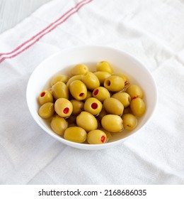 Marinated Green Olives With Pimento Peppers In A Bowl, Side View.