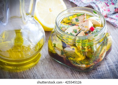 Marinated mozzarella in olive oil with chilli, coriander, parsley, basil, tasty summer italian appetizer - Powered by Shutterstock