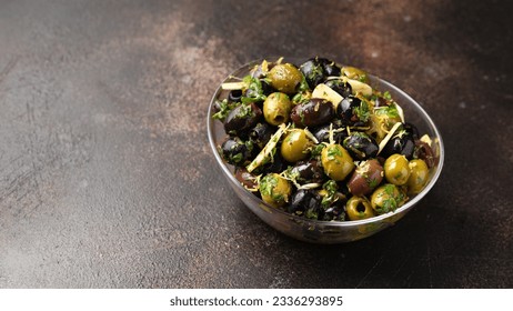 Marinated olives with fresh herbs, garlic, red wine vinegar and lemon zest - Powered by Shutterstock