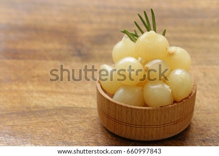 marinated pearl onions in a wooden bowl