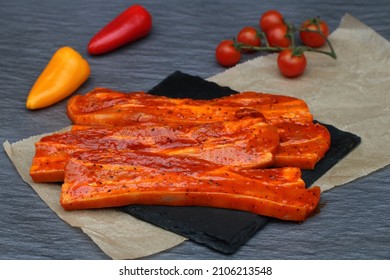 Marinated pork belly with tomatoes and peppers