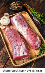 Marinated Pork Tenderloin Meat Steak With Thyme. Dark Wooden Background. Top View