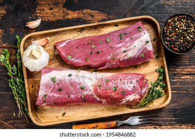 Marinated Pork Tenderloin Meat Steak With Thyme. Dark Wooden Background. Top View