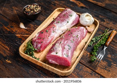 Marinated Pork Tenderloin Meat Steak With Thyme. Dark Wooden Background. Top View