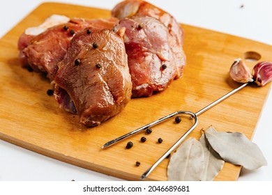 Marinated Pork Tenderloin With Spices. On A Wooden Board