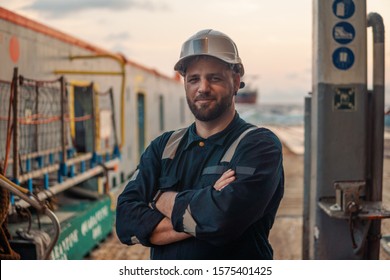 Marine Deck Officer Or Chief Mate On Deck Of Offshore Vessel Or Ship , Wearing PPE Personal Protective Equipment - Helmet, Coverall