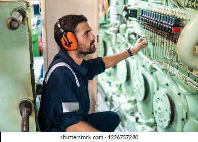 Marine Engineer Officer In Engine Control Room ECR. Seamen's Work. He Starts Or Stops Main Engine Of Ship