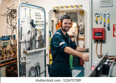 Marine Engineer Officer In Engine Control Room ECR. Seamen's Work. He Starts Or Stops Main Engine Of Ship