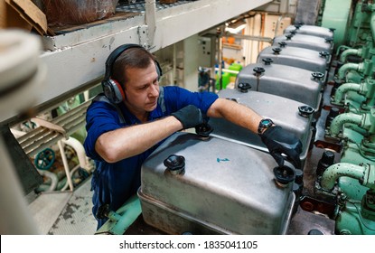 Marine Engineer Officer Reparing Vessel Engines And Propulsion In Engine Control Room ECR. Ship Onboard Maintenance