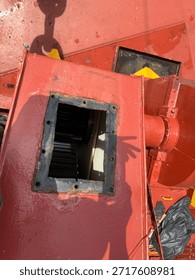 Marine engineer performs maintenance on the deck mooring winch and windlass onboard a container vessel, ensuring safe anchor operations and reliable shipboard cargo handling.