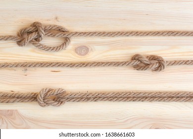 Marine Knots Used In Yachting: Figure Eight Knot, Square Knot, Bowline Knot. Nautical Knots On Wooden Background.