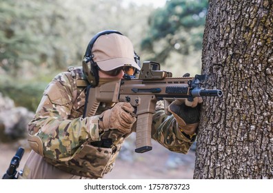 Marine Pointing His Assault Rifle. Playing Airsoft. Scar-L Assault Rifle. Soldier At Gunpoint. Marine Doing Target Practice. Weapons For War. Soldier. Marine. Cutting Weapon Range. Airsoft.