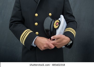 marine sailor holding his hat