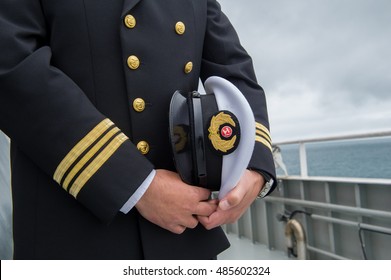 marine sailor holding his hat - Shutterstock ID 485602324