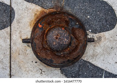 Marine Ship Rusty Mooring Steel Bollard On A Dock. Top View.