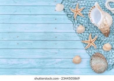 MARINE STILL LIFE BACKGROUND ON BLUE RUSTIC WOODEN TABLE. BEACH SUMMER VACATIONS. TOP VIEW. COPY SPACE.