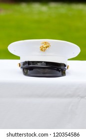 A Marines Hat Off His Head While At A Wedding In Uniform For Armed Forces Soldiers And Family.