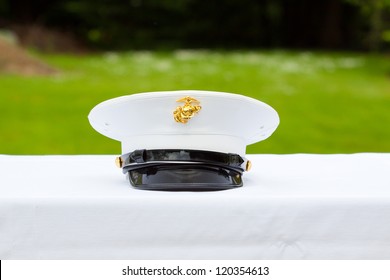 A Marines Hat Off His Head While At A Wedding In Uniform For Armed Forces Soldiers And Family.