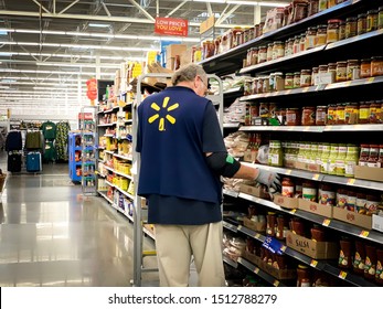 Marinette,WI / USA - Sep18, 2019 : Walmart supermarket employees are sorting the products. Up the floor to allow customers to conveniently shop for products