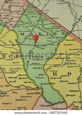 Marion County, South Carolina marked by a red tack on a colorful vintage map. The county seat is located in the city of Marion, SC.