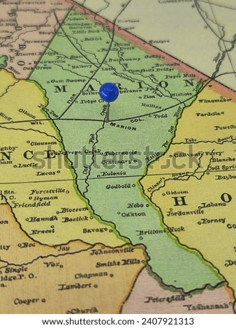 Marion County, South Carolina marked by a blue tack on a colorful vintage map. The county seat is located in the city of Marion, SC.