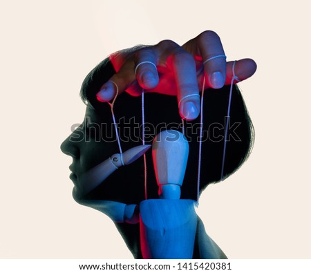 Marionette in woman head. Concept of mind control. Image