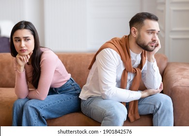 Marital Problems. Unhappy Arab Couple Sitting Back-To-Back Not Talking After Quarrel On Couch At Home. Young Husband And Wife Thinking About Divorce Having Relationship Crisis - Shutterstock ID 1901842576