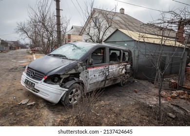 Mariupol, Ukraine Mar 24, 2022: road, neighborhood, houses, car, fire, bomb, shooting,
