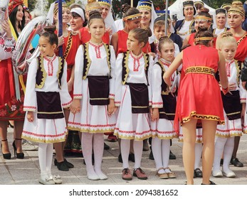 MARIUPOL; UKRAINE-SEPT 25: A group of children in national Greek clothes participating in the Mega Yorty folklore festival September 25, 2021 in Mariupol,Ukraine