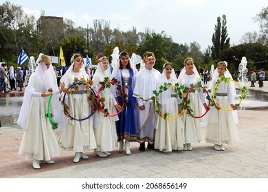 MARIUPOL, UKRAINE-SEPT 25: Group of young participants of the Greek community Ethnic Festival Mega Yorty in stage Greek costumes September 25, 2021 in Mariupol,Ukraine.