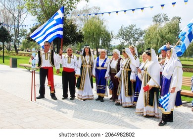 MARIUPOL, UKRAINE-SEPT 25: The participants of Greek community Ethnic Festival Mega Yorty in Greek National costume September 25, 2021 in Mariupol,Ukraine