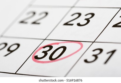 Mark the date number 30. The thirtieth day of the month is marked with a red circle. Focus point on the marked number.