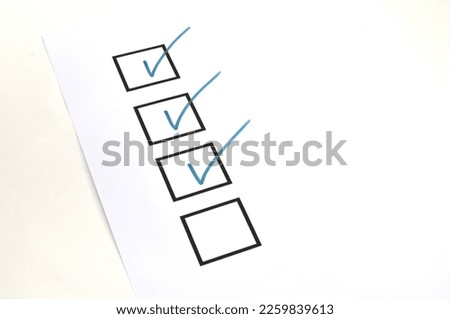 Marked checklist bullet points on paper 