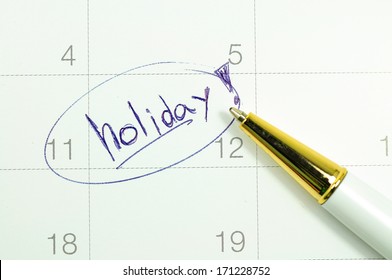 Marked And Written Holiday In A Calendar.