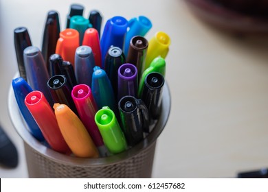 Markers in a cup