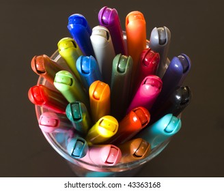 markers on dark background