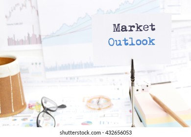 Market Outlook : Investment Overview  Message On The Photo Holder With Background Of  Stationary, Money, Compass,  And Stock Chart 
