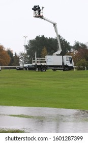 MARKET RASEN RACECOURSE, LINCOLNSHIRE, UK : 7 November 2019 : A Race Tech Cameraman Perched On The Lorry Crane Braves The Wet And Wintery Conditions From Above The Racecourse At Market Rasen Races